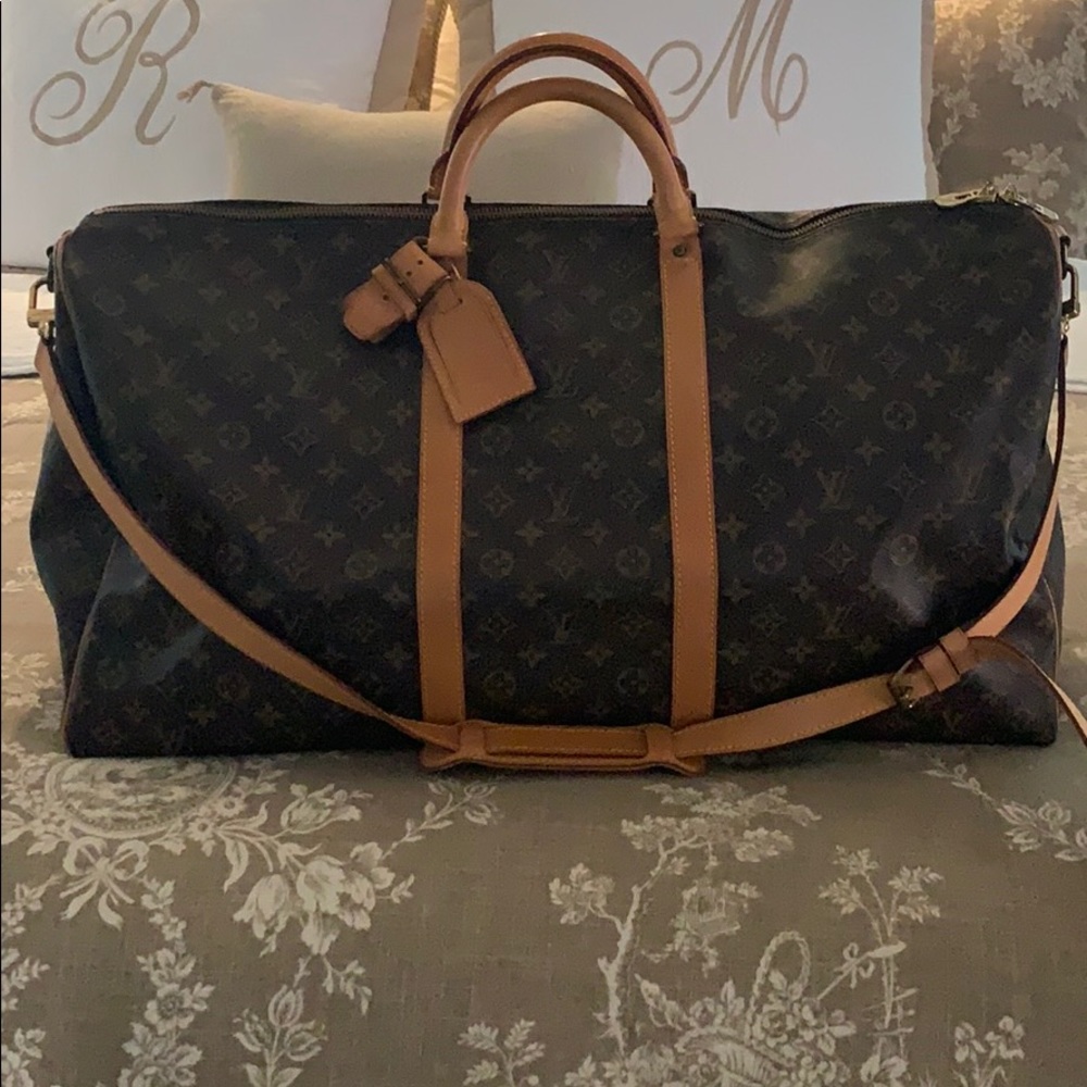 Authentic Louis Vuitton Keepall 55 luggage duffle.